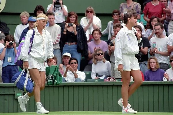 Wimbledon Tennis. J. Capriati and Navratilova walk onto the court. July 1991 91-4197-103