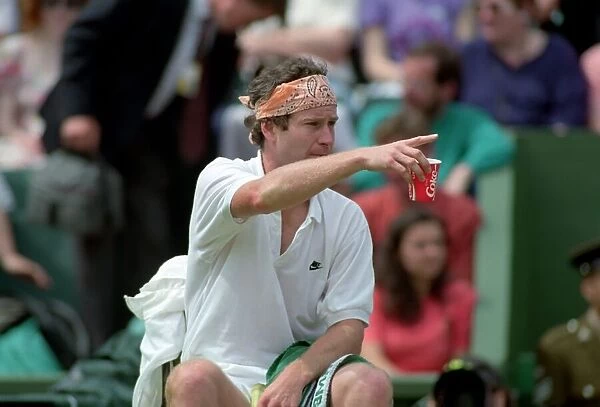 Wimbledon Tennis. John McEnroe (With Eric Crapton Watching). July 1991 91-4197-001