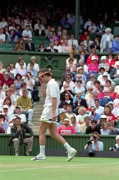 Wimbledon Tennis. John McEnroe arguing with the umpire during game he lost against Stefan