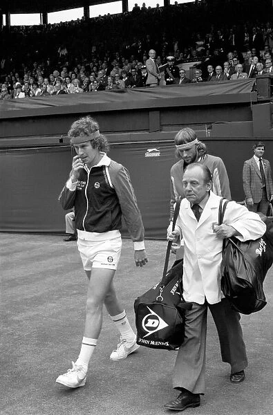 Wimbledon Tennis: Mens Finals 1981: John McEnroe is escorted on to the centre court