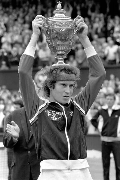 Wimbledon Tennis: Mens Finals 1981: John McEnroe shows of the golden trophy to