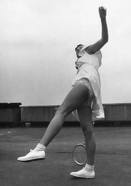 Wimbledon tennis star Gertrude 'Gussie'Moran showing off her new style dress