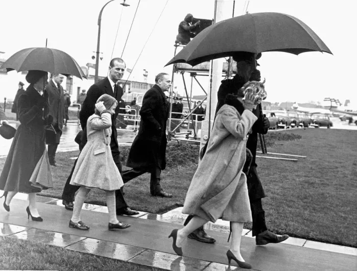 Framed Print : It was a wind-and-the-rain send off for Prince Philip when he left London Airport for his Framed Print : It was a wind-and-the-rain send off for Prince Philip when he left London Airport for his