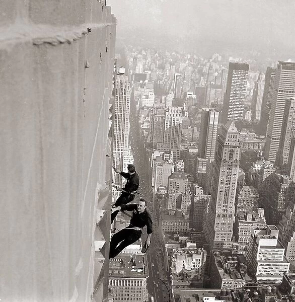 Window Cleaners a 1000 foot above the side walk cleaning December 1964 A©Mirrorpix