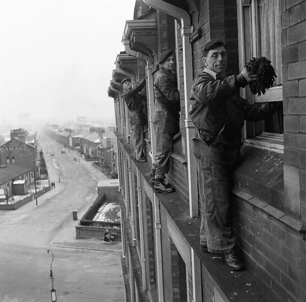 Window cleaners at work. 10th February 1954