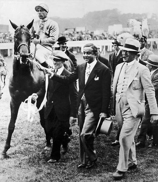 Windsor Lad ridden by Charlie Smirke being led in by the Maharajah of Rajpipla after