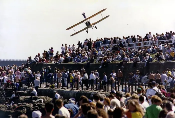 Framed Print : A wing walker performs on the Cadburys Crunchie Boeing-Stearman Model 75 biplane