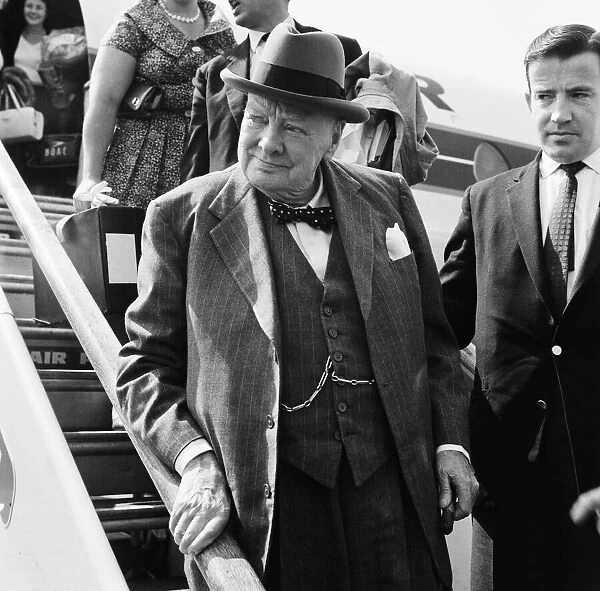 Winston Churchill arriving home at London airport from his holiday in the south of France