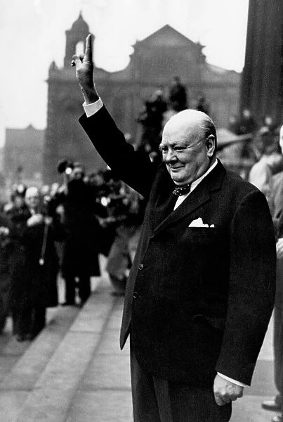 Winston Churchill British Prime Minister holding his fingers up in a V for victory sign