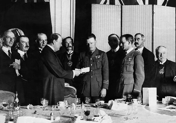 Winston Churchill June 1919 presents Captain John Alcock