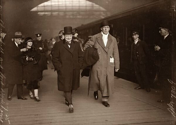 Winston Churchill with Lord Wodehouse at Victoria Train Station en route for Paris