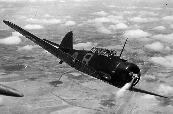 A Wirraway aircraft in flight over Australia. March 1942