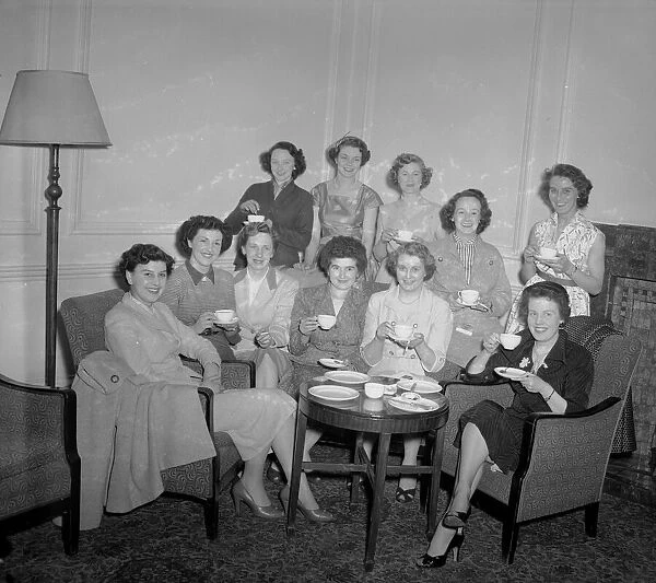 Wives of the Newcastle players seen here gathered together in their London hotel room