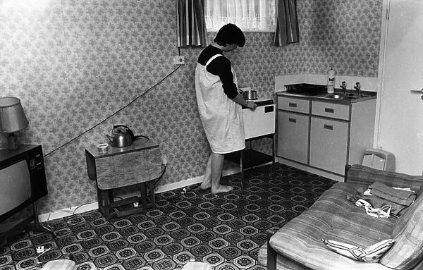 Woman in Bedsit, 23rd September 1982. A one roomed unit of accommodation typically