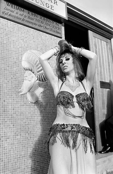 A woman belly dancing for men at The Turks Head Pub in Birmingham. November 1969 Z11189