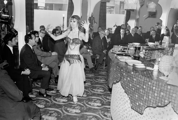 Framed Print : A woman belly dancing for men at The Turks Head Pub in Birmingham Framed Print : A woman belly dancing for men at The Turks Head Pub in Birmingham