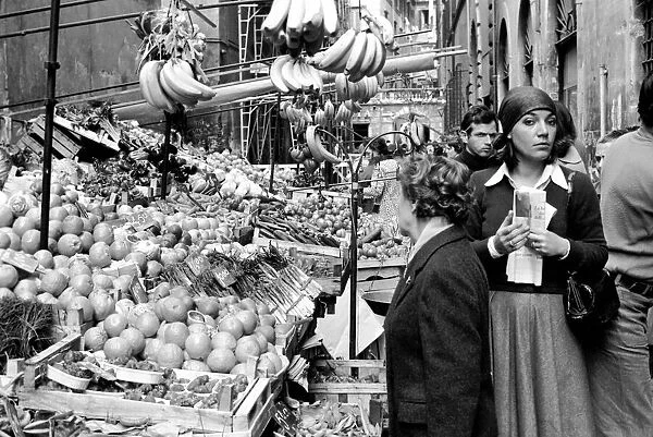 Woman buying fresh fruit and vegetables in a poor suburb on the outskirts of Rome