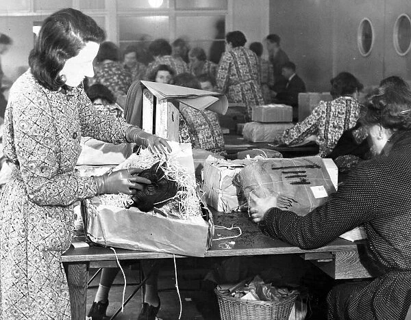 A woman checks for contraband in a sorting office in Aintree, Liverpool. November 1939