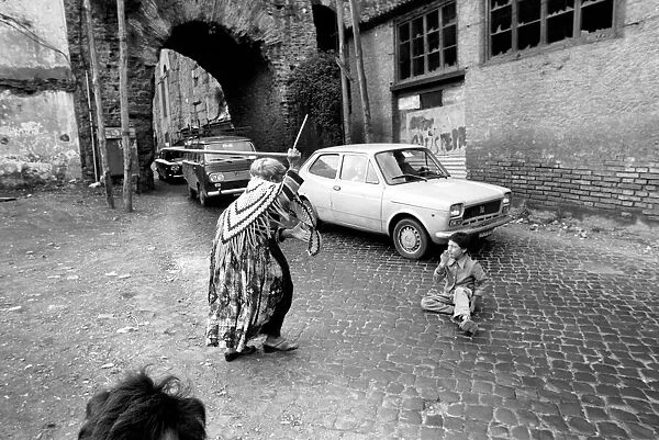 Woman and child in the streets in a poor suburb on the outskirts of Rome