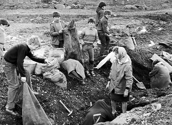 A woman and children join in the coal dig at the new Kilmarnoch site, May 1971