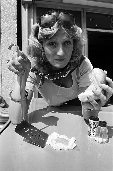 A woman cooks an egg on a car bonnet during the 1976 heatwave. 25th June 1976