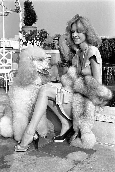 Woman and dog. Suzanna Leigh at todays photo session with her poodle Natashia