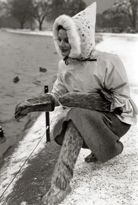 Framed Print : A woman dressed in a strange outfit including matching boots