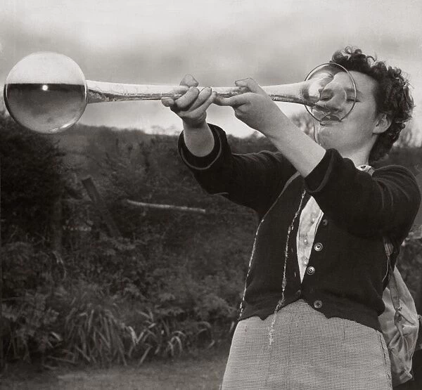 A woman drinking a yard of ale April 1952