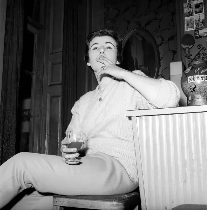 Framed Print : Woman enjoying a cigarette and a drink in a London bar. 1960 Framed Print : Woman enjoying a cigarette and a drink in a London bar. 1960
