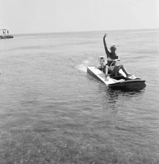 Framed Print : Woman enjoys a trip on a speedboat during a holiday on the French Riviera