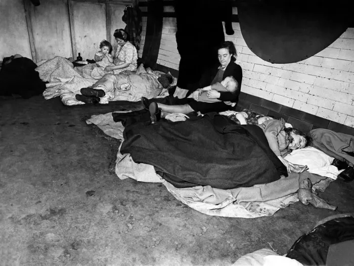 Framed Print : Woman feeding her baby in an underground tube station used as an air raid shelter during