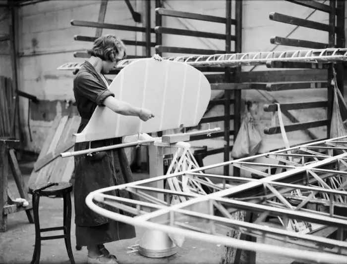 Framed Print : Woman fitting the rudder during the construction of the Miles 3 Falcon aircraft Framed Print : Woman fitting the rudder during the construction of the Miles 3 Falcon aircraft