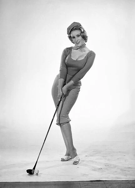 Woman golfer, model Rita Royce. 1960 E389-005