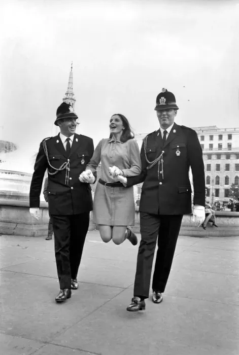 Framed Print : Woman being held up by two policemen in Trafalgar Square, London. October 1969 Z10351 Framed Print : Woman being held up by two policemen in Trafalgar Square, London. October 1969 Z10351