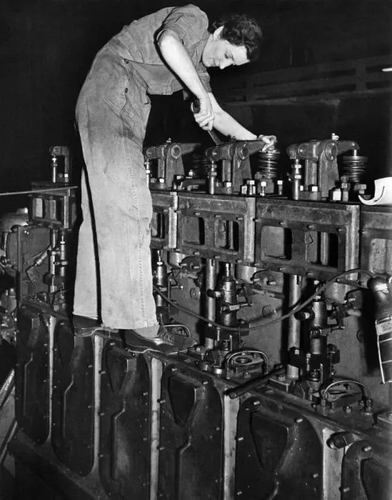 Framed Print : This woman is helping in the maintenance of a railway Diesel engine Framed Print : This woman is helping in the maintenance of a railway Diesel engine