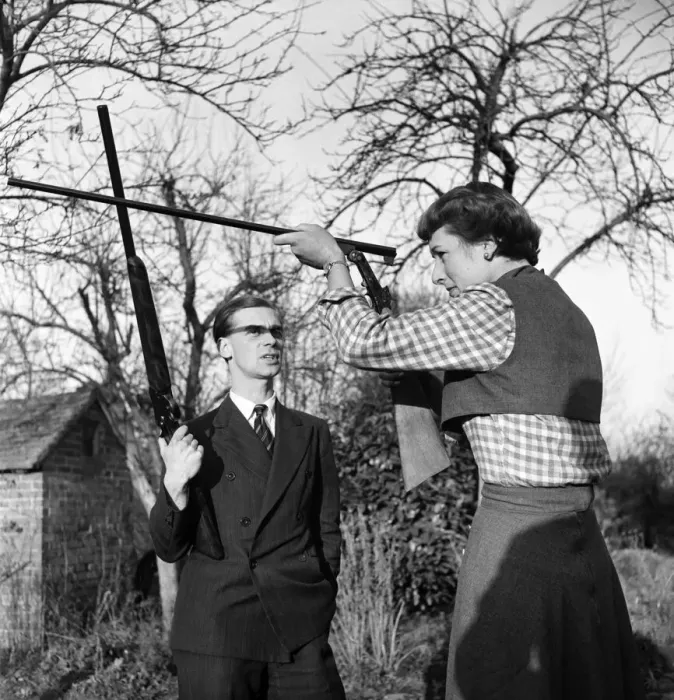 Framed Print : Woman at home with her husband shooting in their garden at home at Branley in Surrey Framed Print : Woman at home with her husband shooting in their garden at home at Branley in Surrey