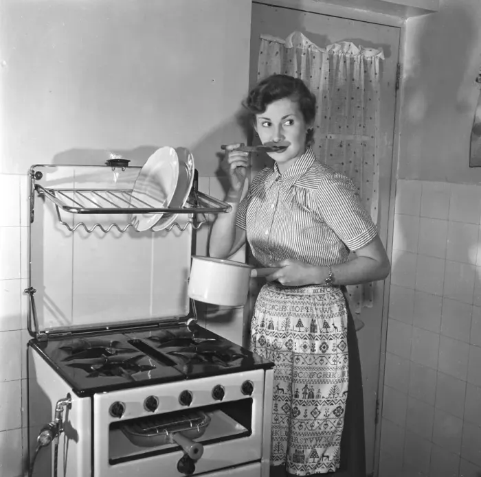 Framed Print : Woman in kitchen. Circa 1952 Framed Print : Woman in kitchen. Circa 1952