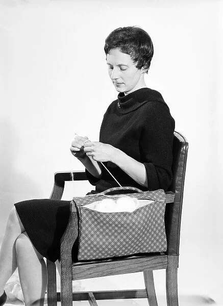 Woman knitting pose in the Daily Mirror studios Circa 1959