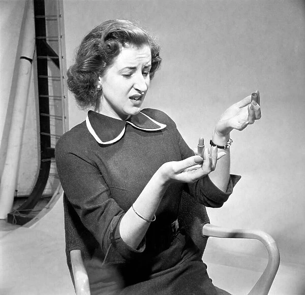 Woman with lipstick refil. November 1952 D6882-1