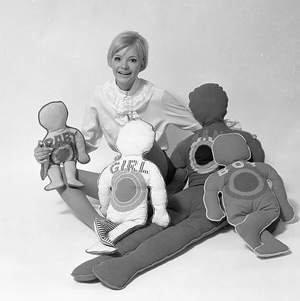 Woman Model with pillows in the shape of man and child. January 1968. Y5