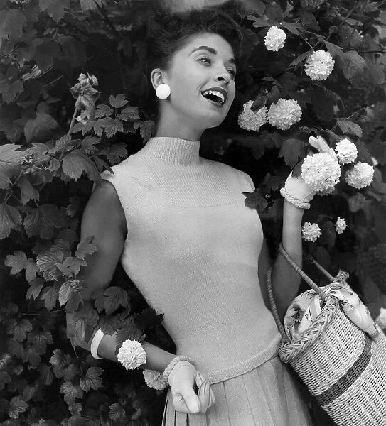 A woman modelling Knitwear. July 1956