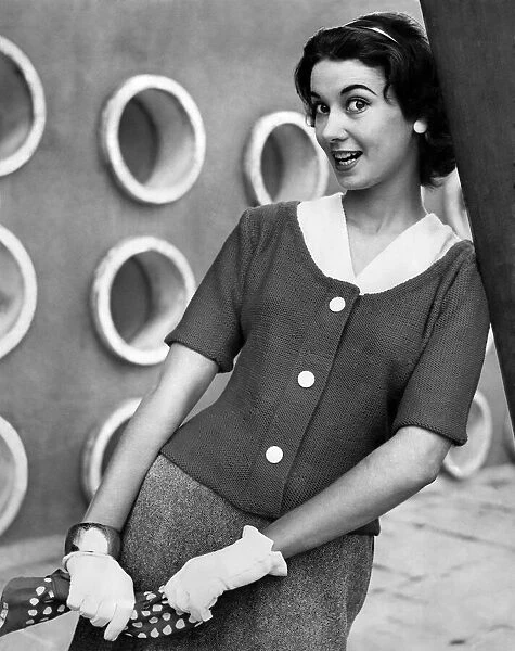 A woman modelling Knitwear. September 1956