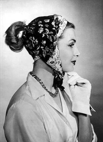 A woman modelling a scarf designed to be worn in five different ways