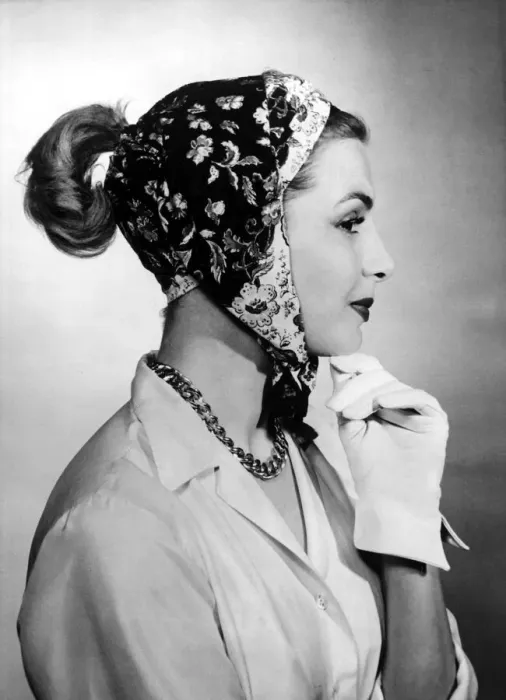Framed Print : A woman modelling a scarf designed to be worn in five different ways Framed Print : A woman modelling a scarf designed to be worn in five different ways