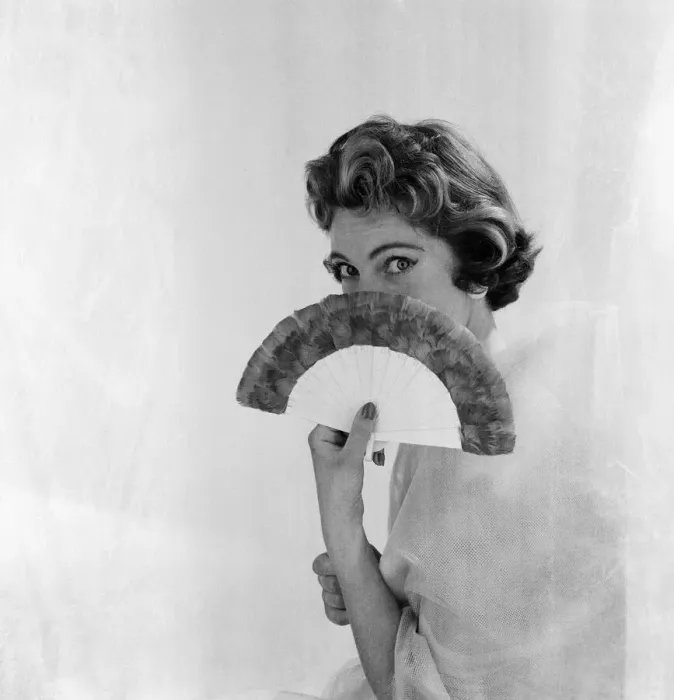 Framed Print : Woman pictured with a fan. Photographed for an article in The Daily Mirror by Helen Hugh Framed Print : Woman pictured with a fan. Photographed for an article in The Daily Mirror by Helen Hugh