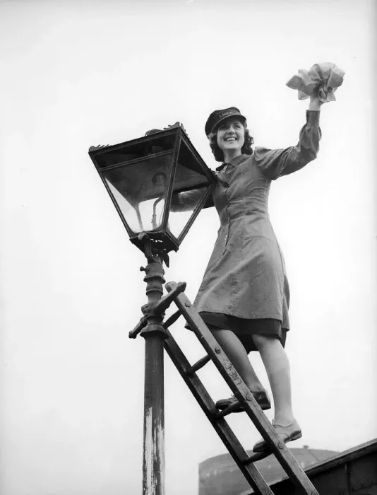 Framed Print : Woman Railway Porter cleaning a lamp 1941 women doing mens jobs during the war Framed Print : Woman Railway Porter cleaning a lamp 1941 women doing mens jobs during the war