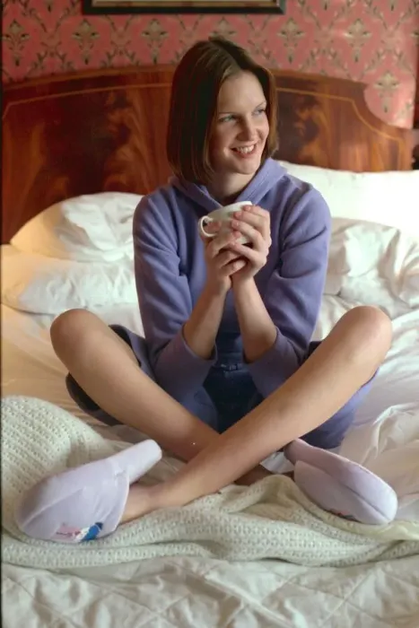 Framed Print : Woman settles down for cosy night in the house wearing the latest lounge wear