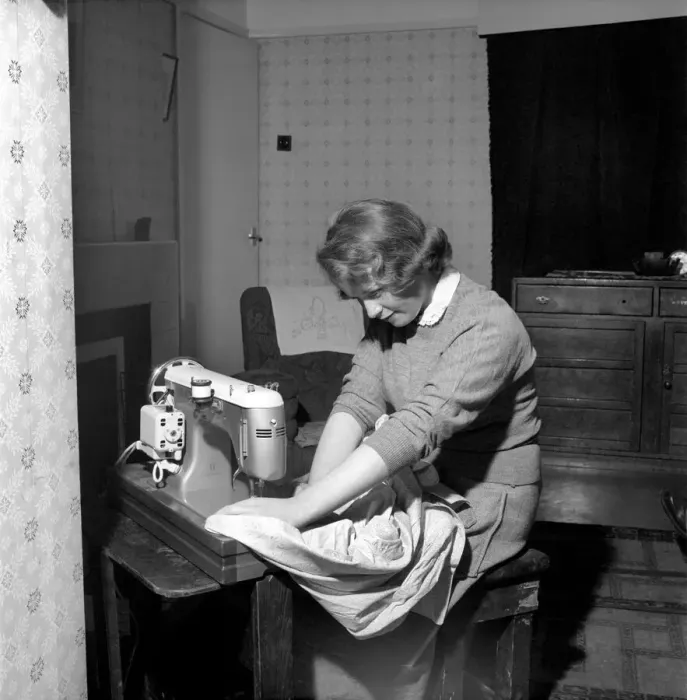 Framed Print : Woman at sewing machine: Mrs. John Theakeston seen here making a dress Framed Print : Woman at sewing machine: Mrs. John Theakeston seen here making a dress