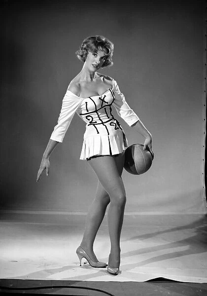 Woman (Shelia Robens) seen here dress in football costume. 1957
