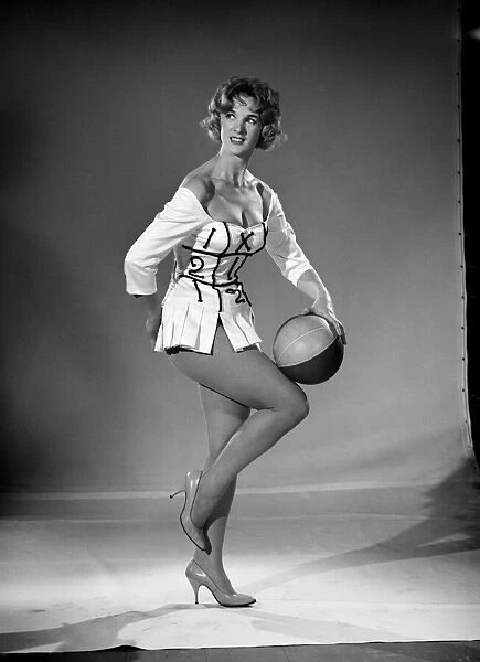Woman (Shelia Robens) seen here dress in football costume. 1957